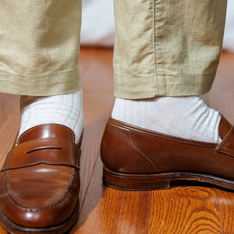 white dress socks with tan linen slacks and brown penny loafers