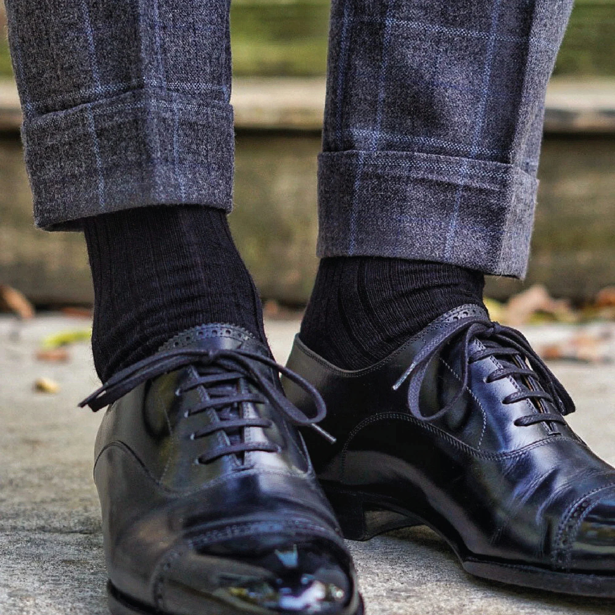 man wearing over the calf mens black dress socks with grey slacks and black shoes