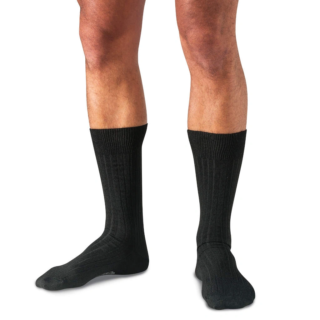 model wearing black merino wool dress socks